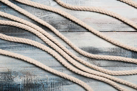 Long ropes on wooden backgroundの写真素材