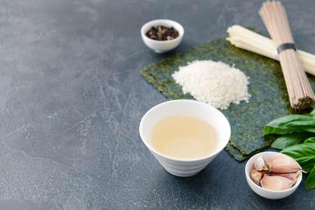 Composition with rice vinegar on tableの写真素材