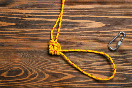 Rope with lobster clasp on wooden backgroundの写真素材