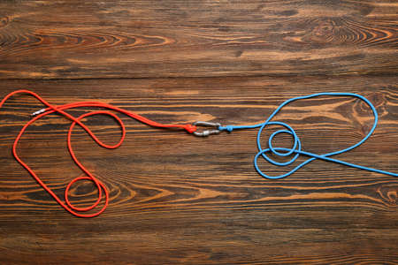 Ropes with lobster clasp on wooden backgroundの写真素材