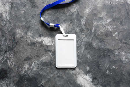 Blank badge on dark tableの写真素材