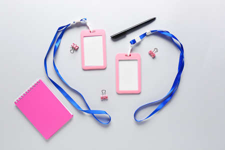 Blank badges and stationery on white background