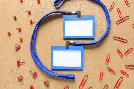 Composition with blank badges and stationery on color backgroundの写真素材