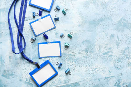 Blank badges and stationery on color backgroundの写真素材