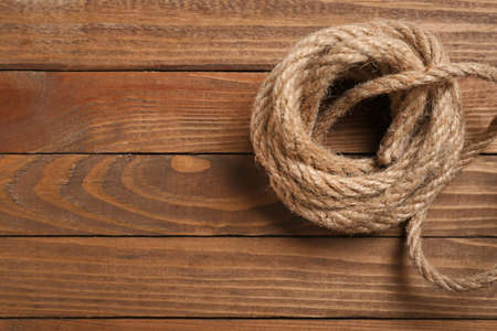 Rolled rope on wooden backgroundの写真素材