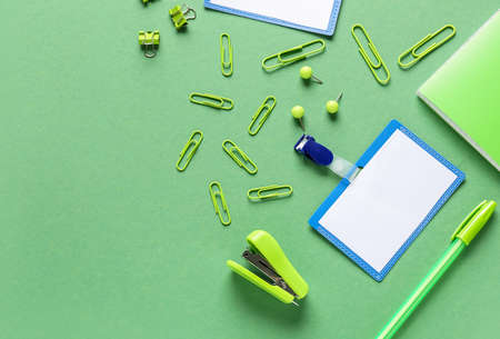 Blank badges and stationery on color background
