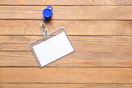 Blank badge on wooden backgroundの写真素材