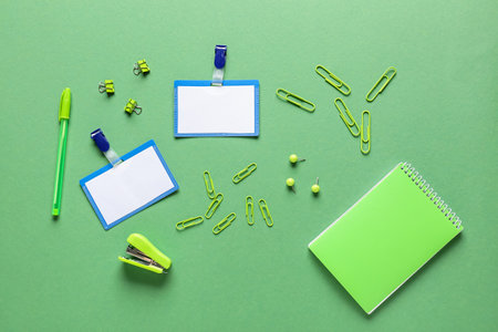 Blank badges and stationery on color background