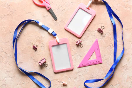 Blank badges and stationery on color backgroundの写真素材