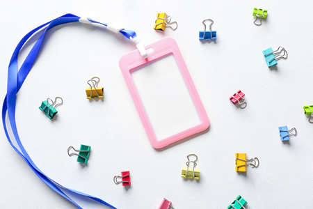 Blank badge and stationery on white background