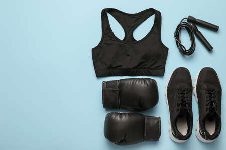 Sports equipment with clothes on color backgroundの写真素材