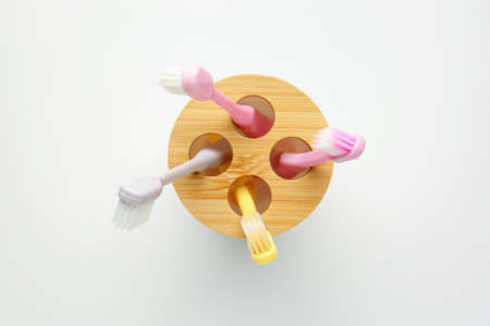 Holder with wooden toothbrushes isolated on white backgroundの写真素材