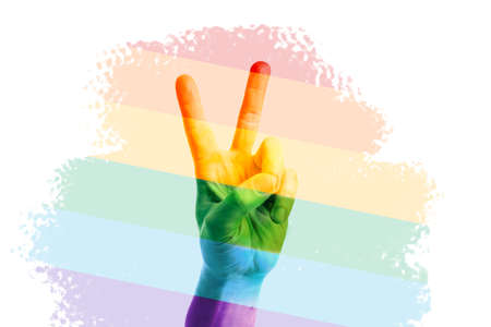 Gesturing male hand painted in colors of LGBT flag on white backgroundの写真素材