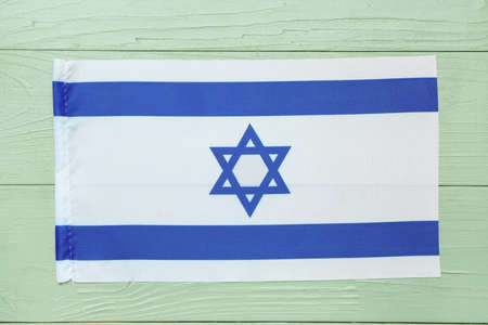 Flag of Israel on wooden backgroundの写真素材