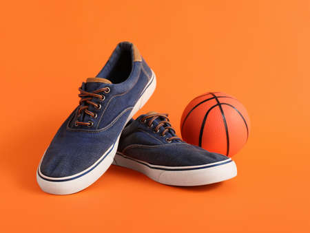 Casual male shoes on color background