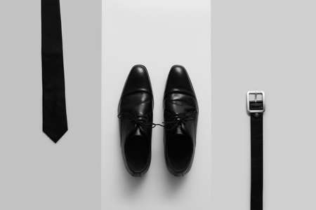 Stylish male shoes and accessories on light backgroundの写真素材