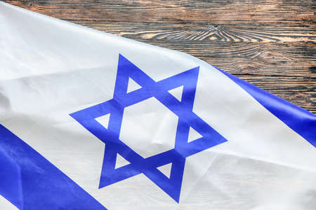 Flag of Israel on wooden backgroundの写真素材