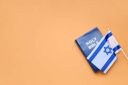 Holy Bible and flag of Israel on color backgroundの写真素材