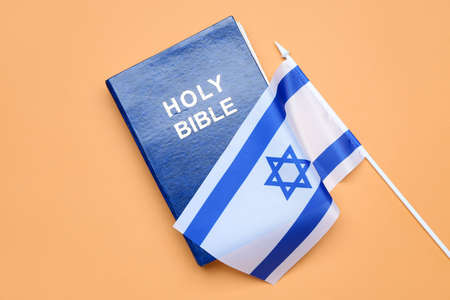 Holy Bible and flag of Israel on color backgroundの写真素材