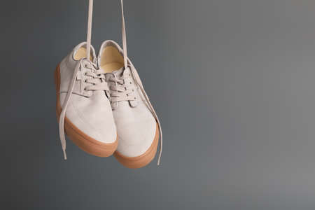 Pair of casual male shoes on dark background
