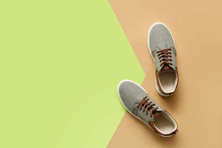 Casual male shoes on color backgroundの写真素材