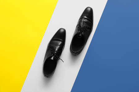 Classic leather male shoes on color backgroundの写真素材