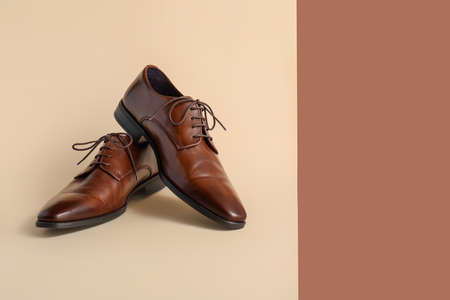 Classic leather male shoes on color backgroundの写真素材