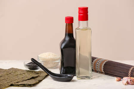 Composition with rice vinegar on table