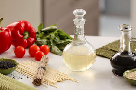 Composition with rice vinegar on tableの写真素材