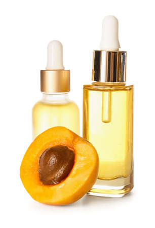 Bottles of apricot essential oil on white backgroundの写真素材