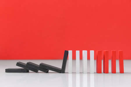 Domino on color background. Concept of stressの写真素材