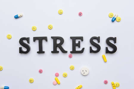 Word STRESS and pills on light backgroundの写真素材