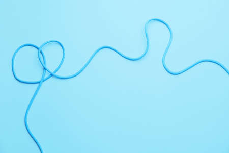 Long rope on color background