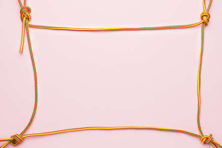 Frame made of rope on color backgroundの写真素材