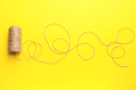 Thread on color background, top view