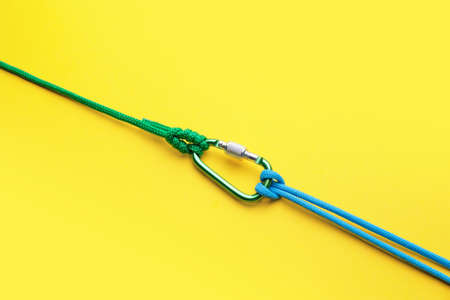 Ropes with lobster clasp on color backgroundの写真素材