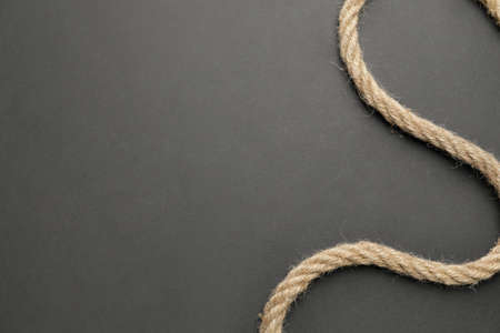Long rope on dark background
