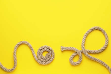 Long ropes on color background