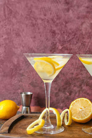 Glass of fresh martini on dark backgroundの写真素材