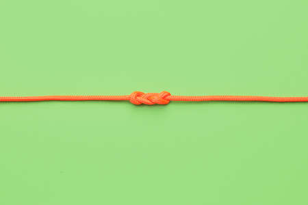 Rope with knot on color backgroundの写真素材