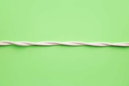 Long twisted ropes on color background