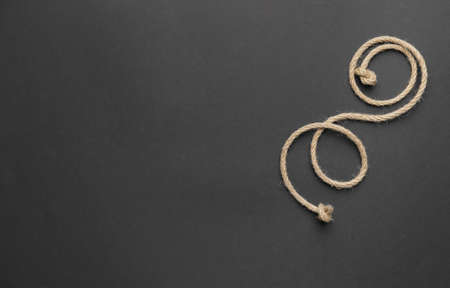 Long rope on dark backgroundの写真素材