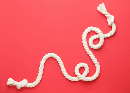 Long rope on color background