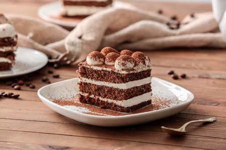Plate with tasty tiramisu on tableの写真素材
