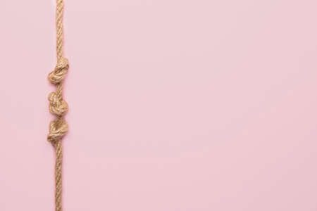 Rope with knots on color backgroundの写真素材