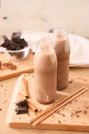 Bottles of aromatic chocolate milk on tableの写真素材