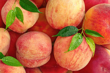 Sweet ripe peaches as background