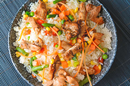 Bowl with tasty fried rice on table, closeupの写真素材