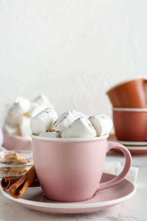 Cup of hot cacao drink with marshmallows on tableの写真素材