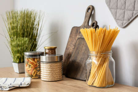 Jars with products on counter in kitchenの写真素材